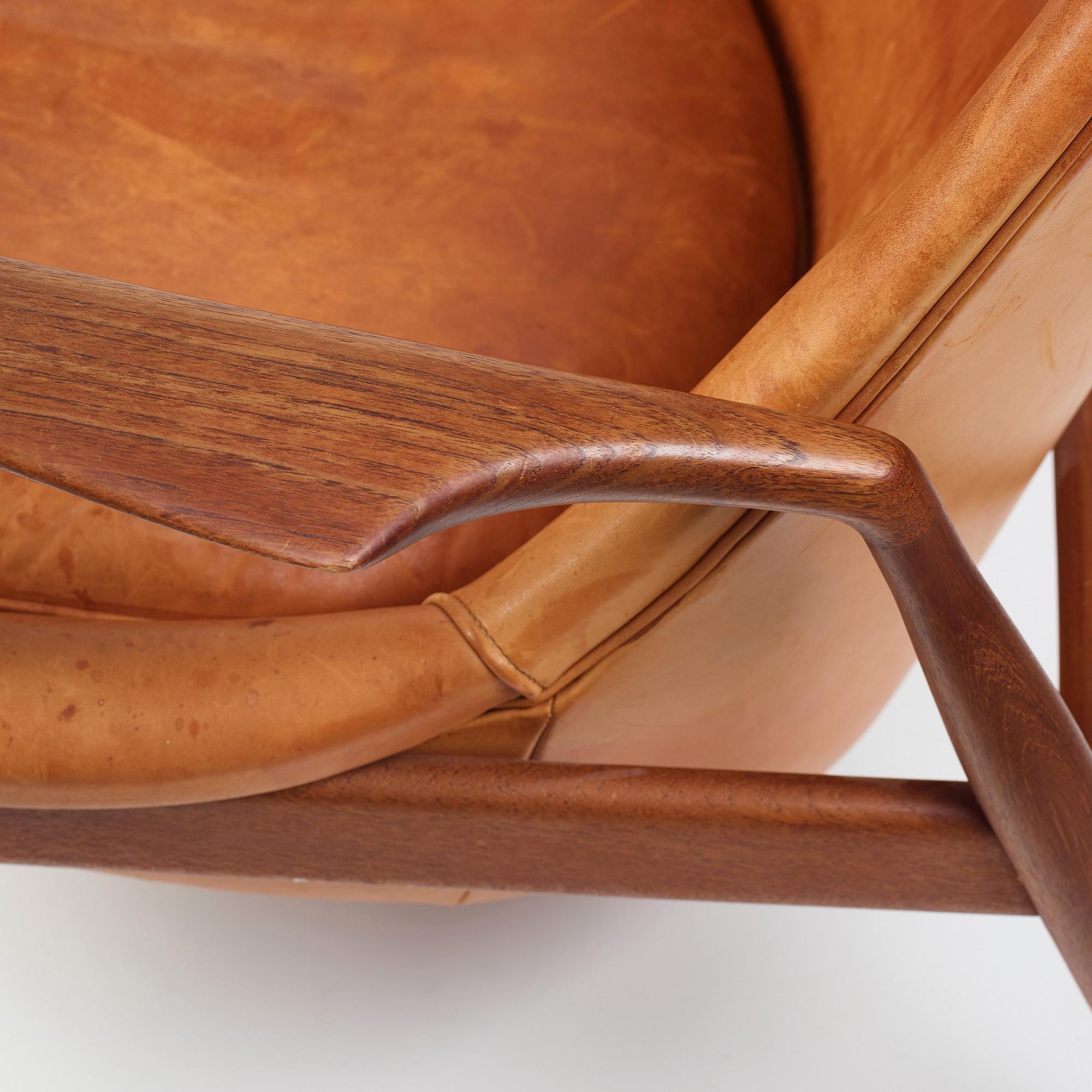 Ib Kofod-Larsen, a "Seal" teak and brown leather armchair, Olof Persson Möbler, Jönköping, Sweden 1950-60's.