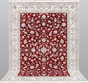 A Nain part silk carpet, 302 x 204 cm.