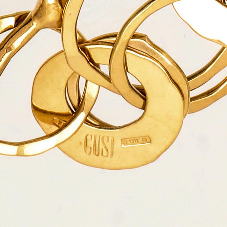 An 18K gold bracelet from Cusi Italy.