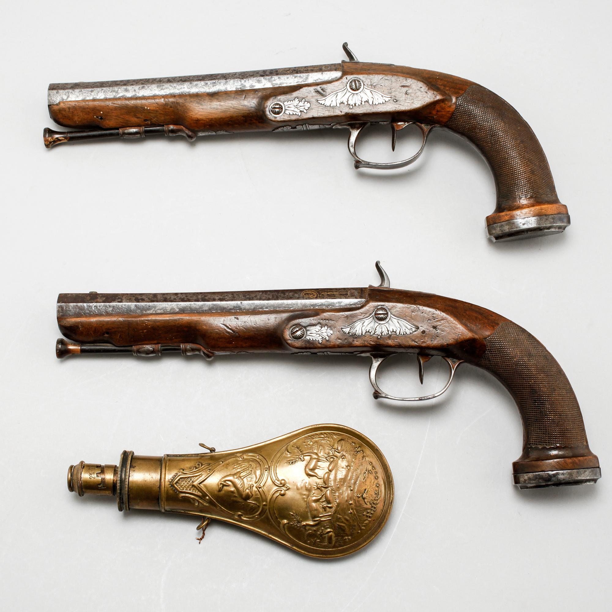 A pair of percussion guns, around the mid 19th century.