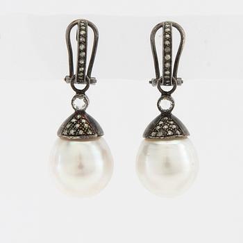Earrings, a pair of oxidised silver with diamonds and cultured drop-shaped pearls.