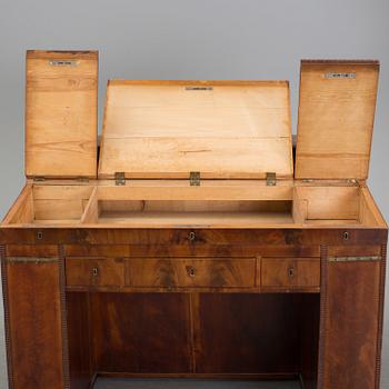 A mid 19th century writing desk and chair.