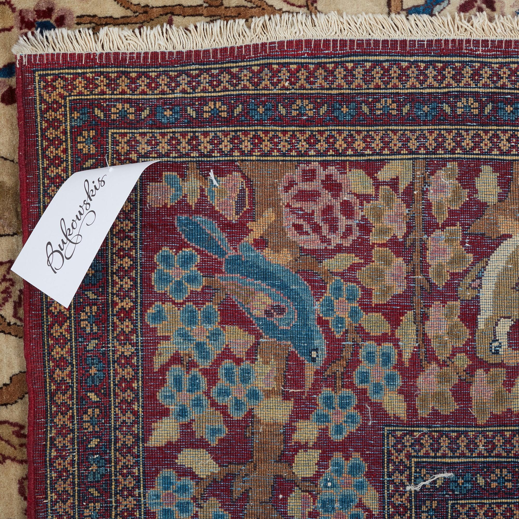 A RUG, a semi-antique Esfahan probably, figural, ca 214,5 x 137,5 cm.
