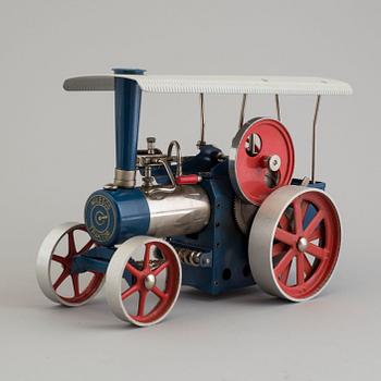 a Wilesco traktor painted tin car from the mid 20th century.