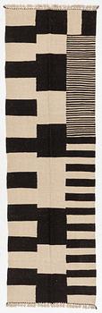 A Kelim runner carpet, 300 x 93 cm.