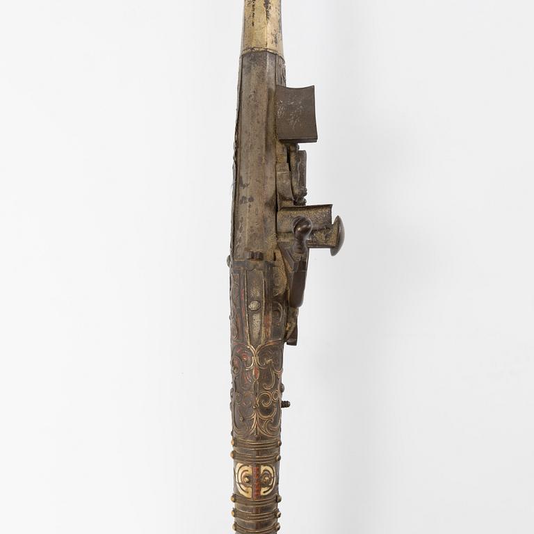A snaphaunce gun, 19th Century.