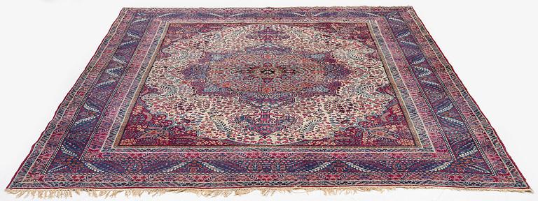 A semi-antique Kirman carpet, South Persia, c. 380 x 289 cm.