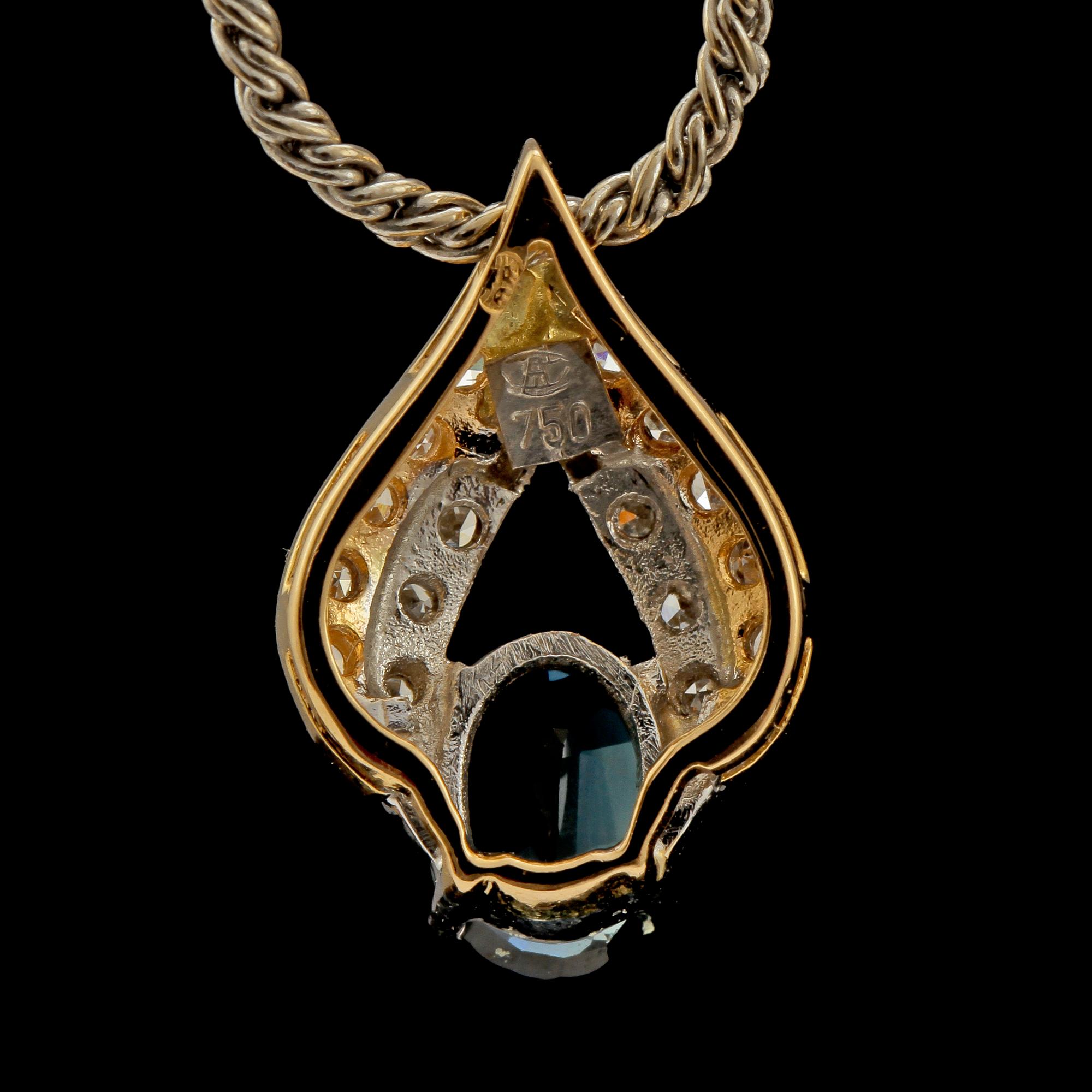 HÄNGE, 18k guld och vitguld med fasettslipad blå safir samt 16 åttkantslipade diamanter, 1900-talets slut. Vikt 8 g.