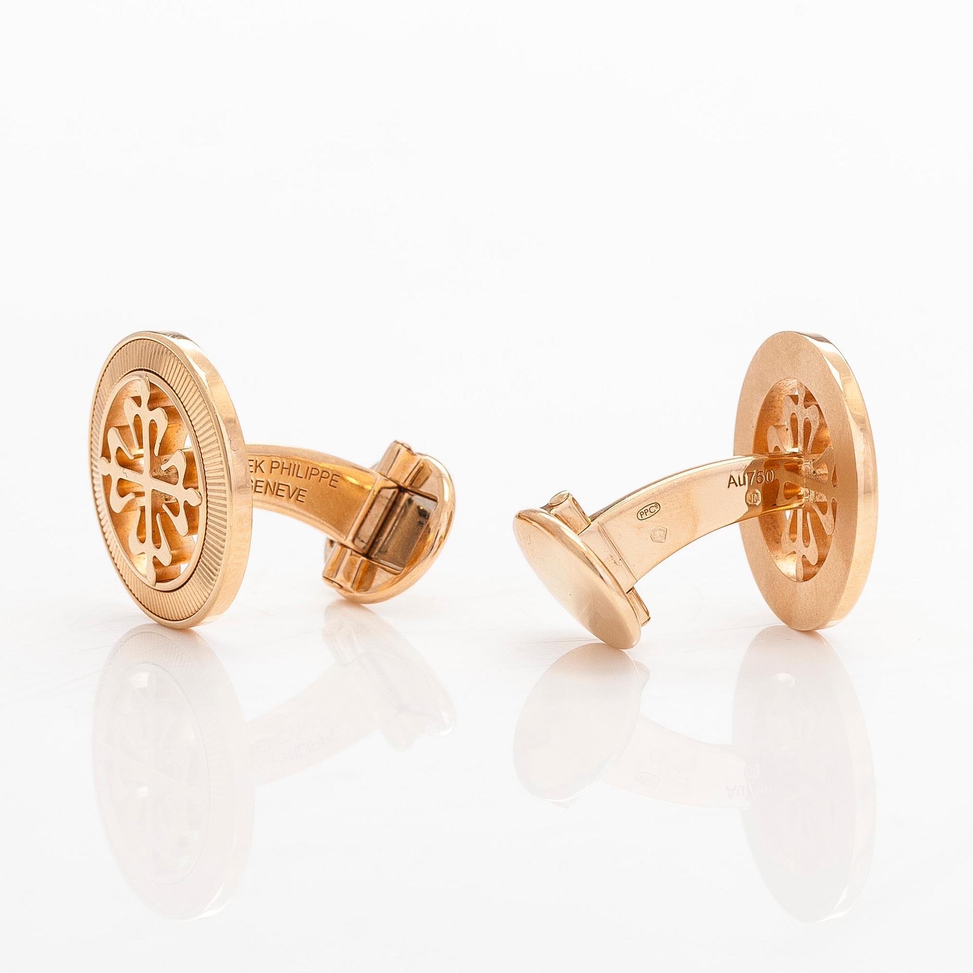 Patek Philippe, a pair of 18K gold "Calatrava" cufflinks.