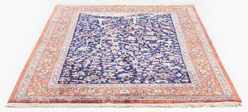 A signed pictoral silk Qum rug, c. 203 x 127 cm.