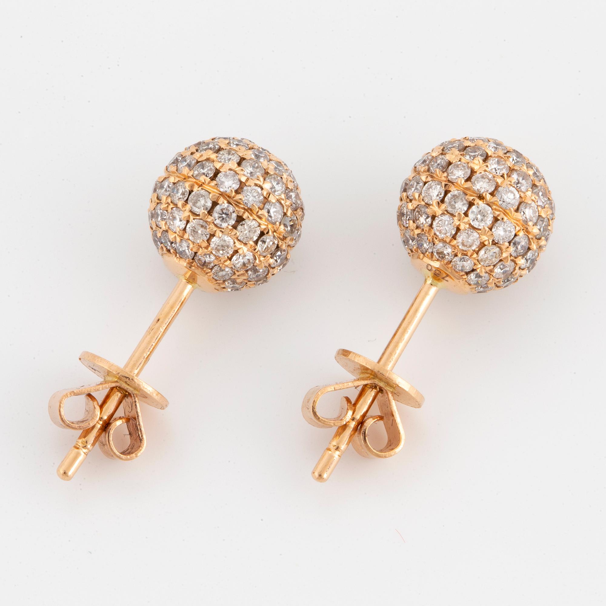 Brilliant-cut diamond ball earrings.