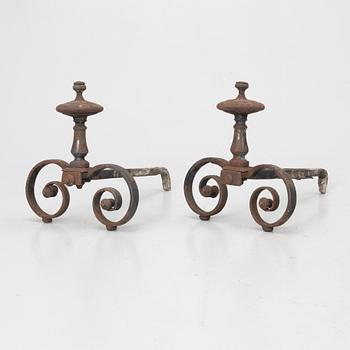 A pair of wrought iron fire dogs.