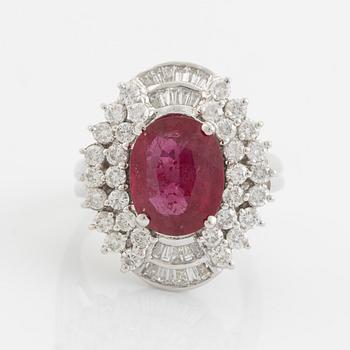 Ruby, baguette- and brilliant cut diamond ring.
