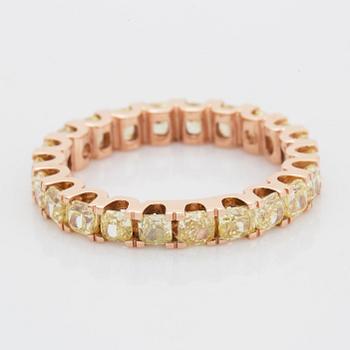 Cushion-cut yellow diamond eternity ring.