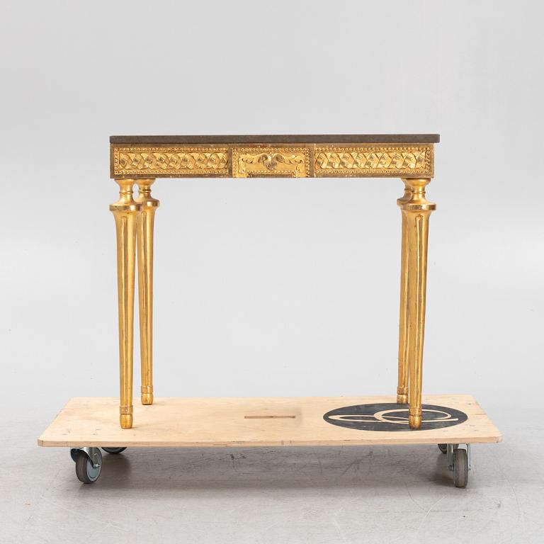 A console table with stone top.