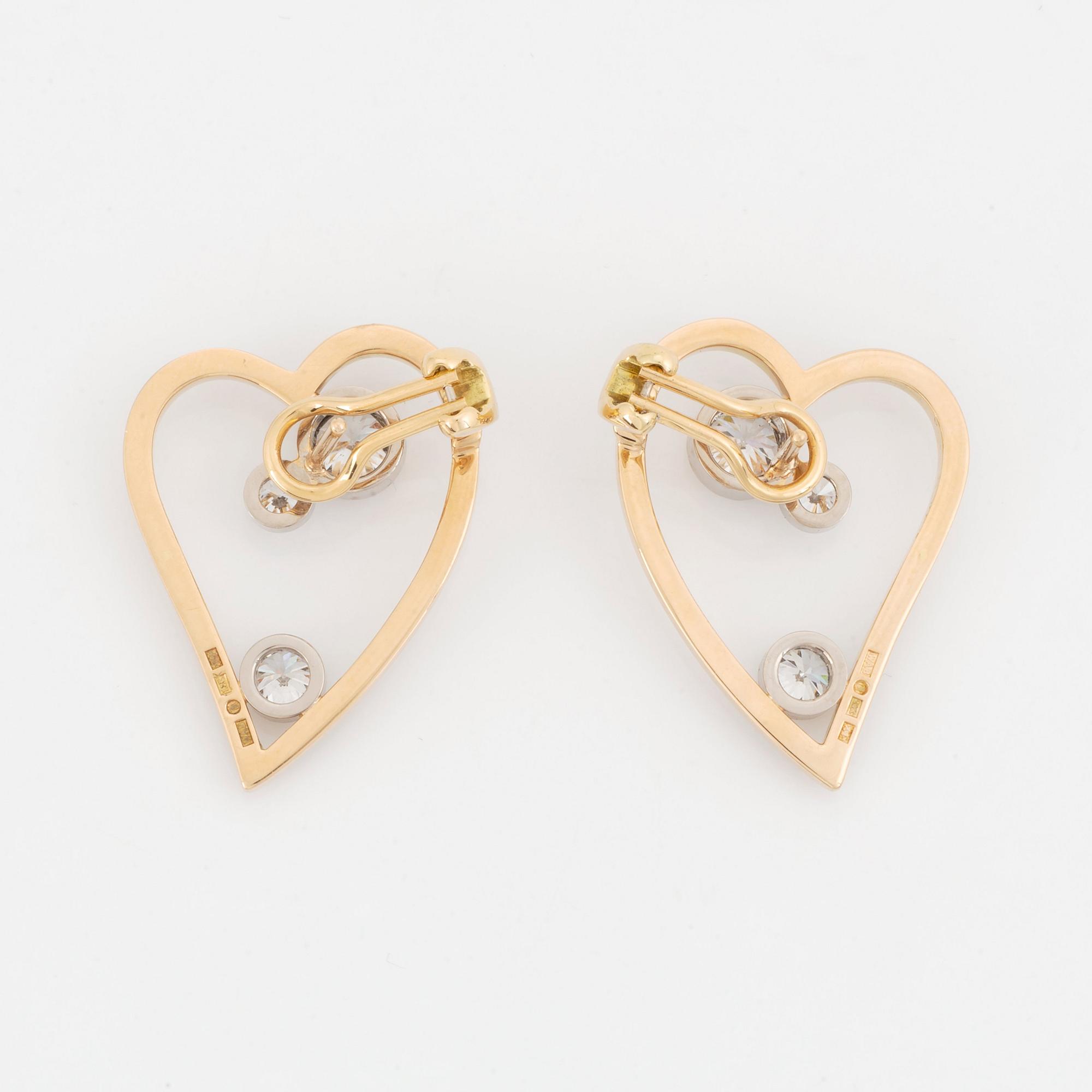 WA Bolin a pair of earrings in 18K gold and white gold set with round brilliant-cut diamonds.