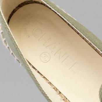 A pair of espadrilles from Chanel.