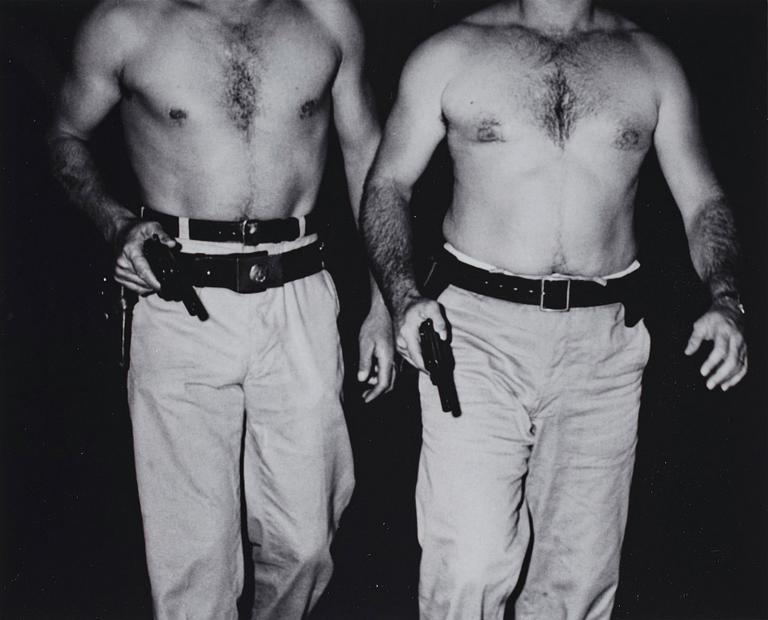 Weegee, "Two police officers who dove into the Hudson RIver to save Donna Landon, New York, July 20 1941".