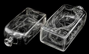 BRÄNNVINSFLASKOR, 2 st, glas, daterade 1833 respektive 1843.