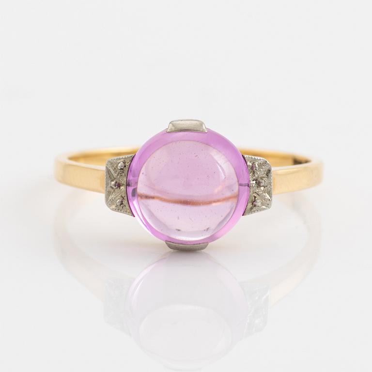 18K gold and cabochon cut syntehtic pink sapphire.
