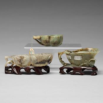 624. A Chinese group of three sculptured cups.