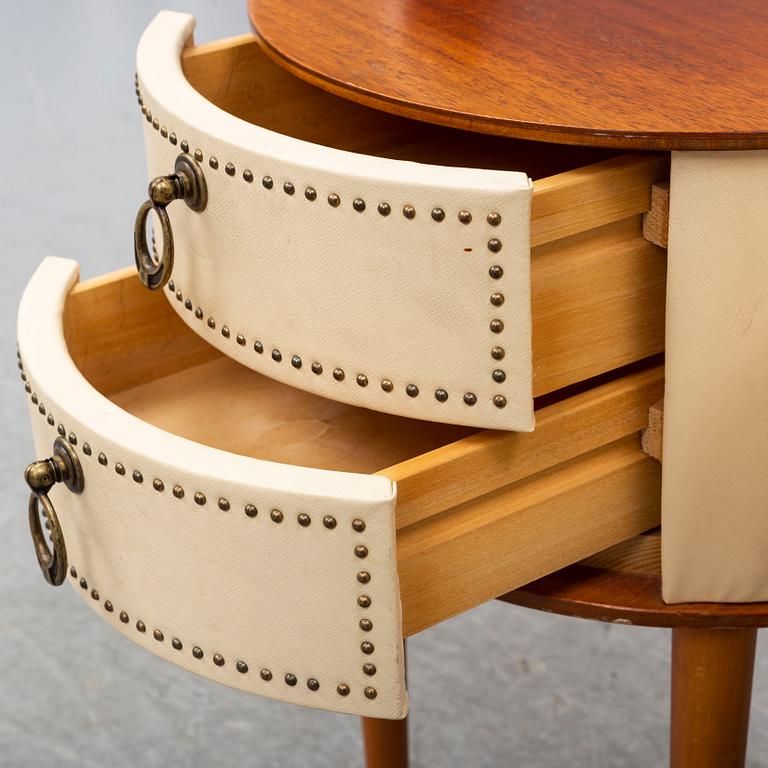 A pair of mid 20th Century bedside tables.