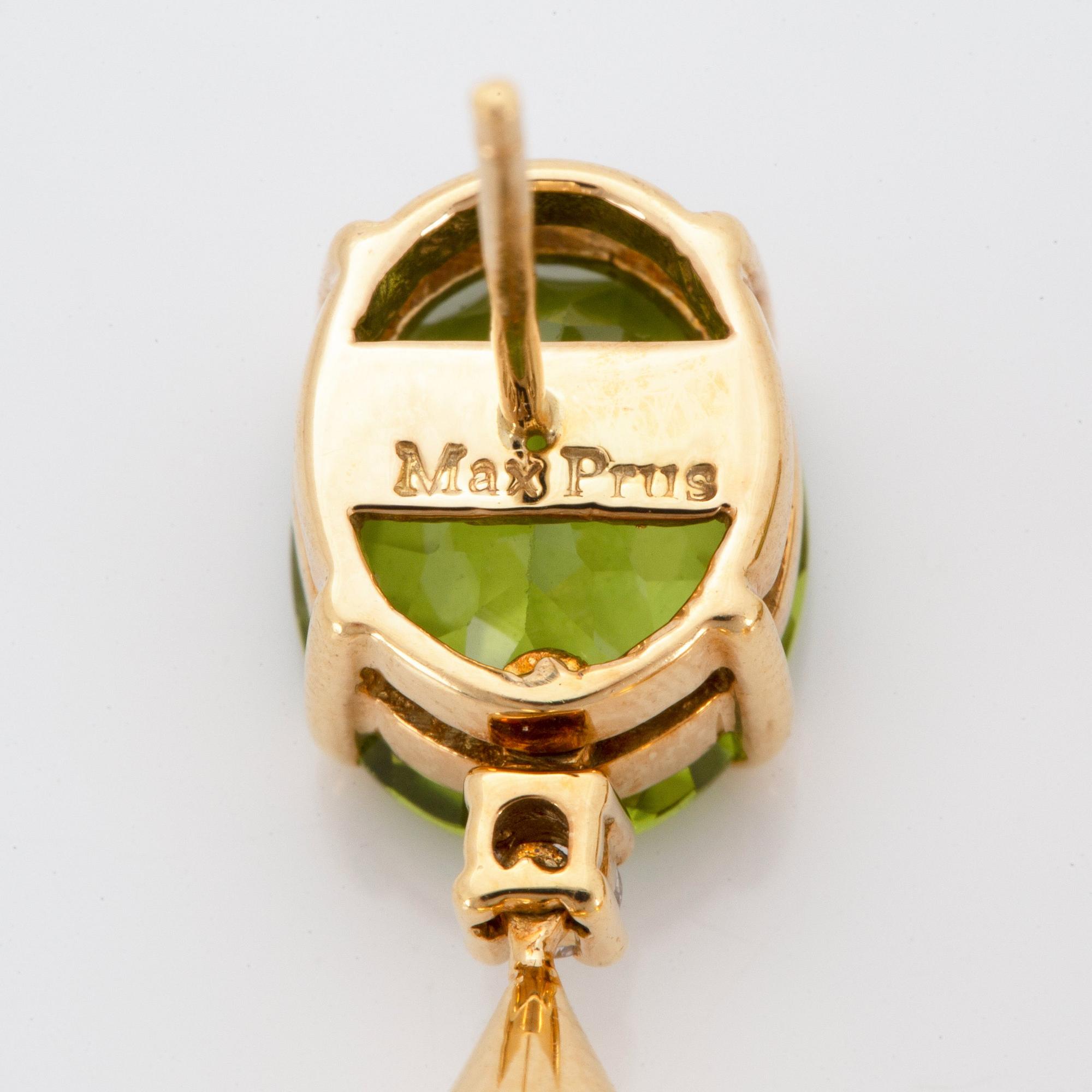 A pair of 18K gold earrings set with faceted peridots and with briolette-cut citrines.