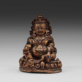 369. A gilt copper alloy figure of Kubera, Tibet, 15th Century.