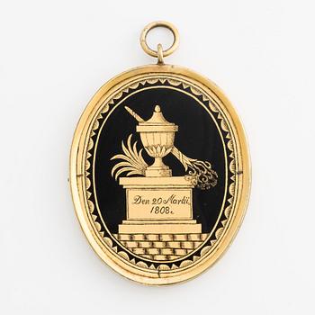 Pendant/memorial medallion with silhouette.