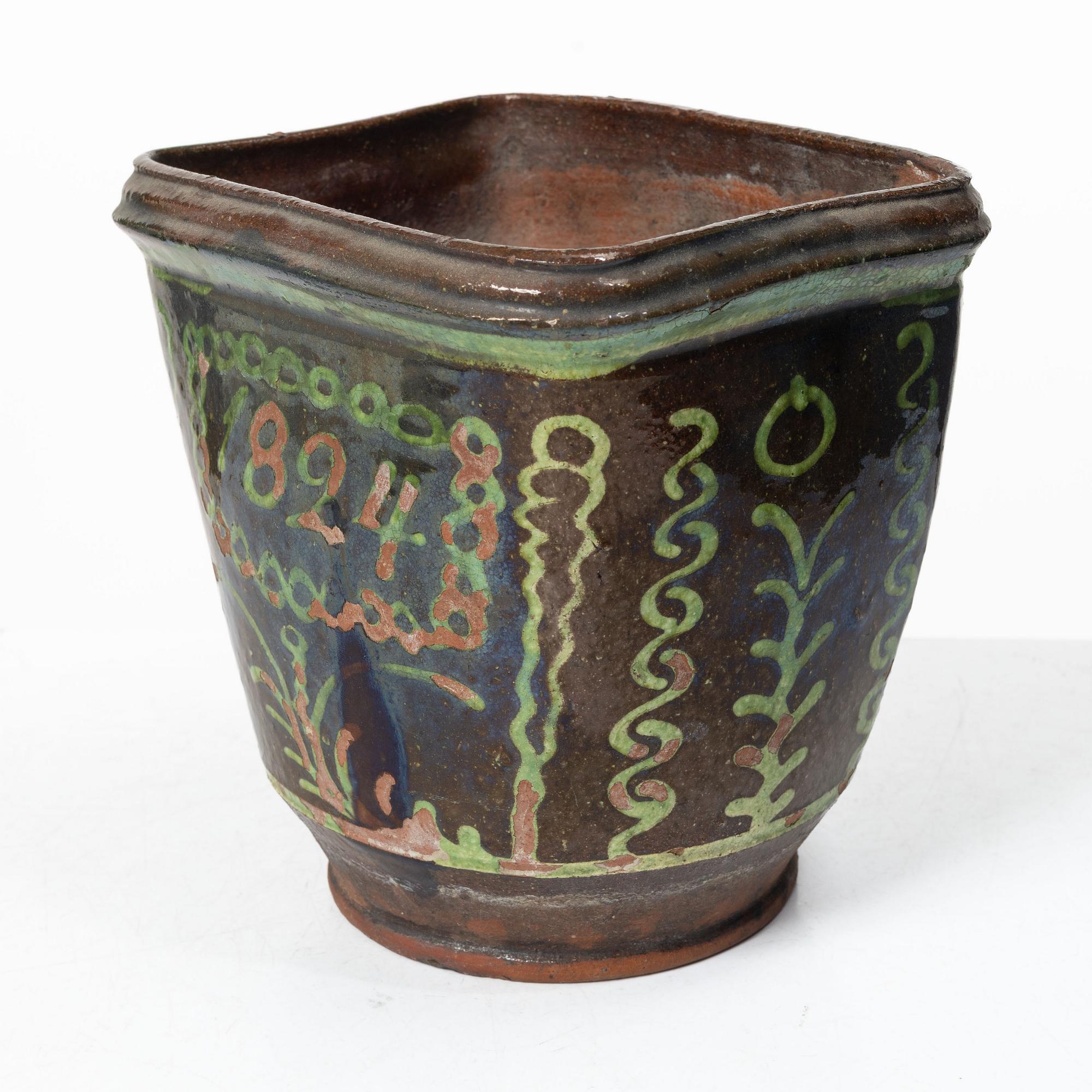 Stoneware planter and stand, dated 1824.
