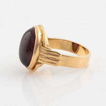 18K gold and cabochon cut garnet ring.