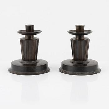 A pair of bronze candlesticks, 1920's-/30's.