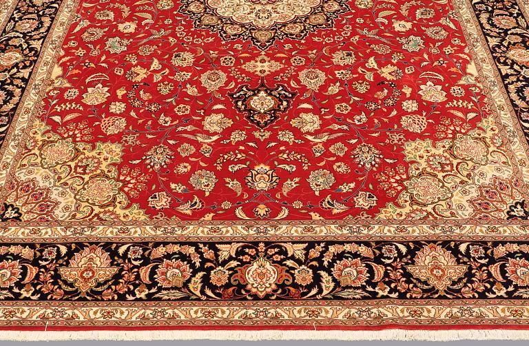 A carpet, Täbriz part silk, 341 x 248 cm.