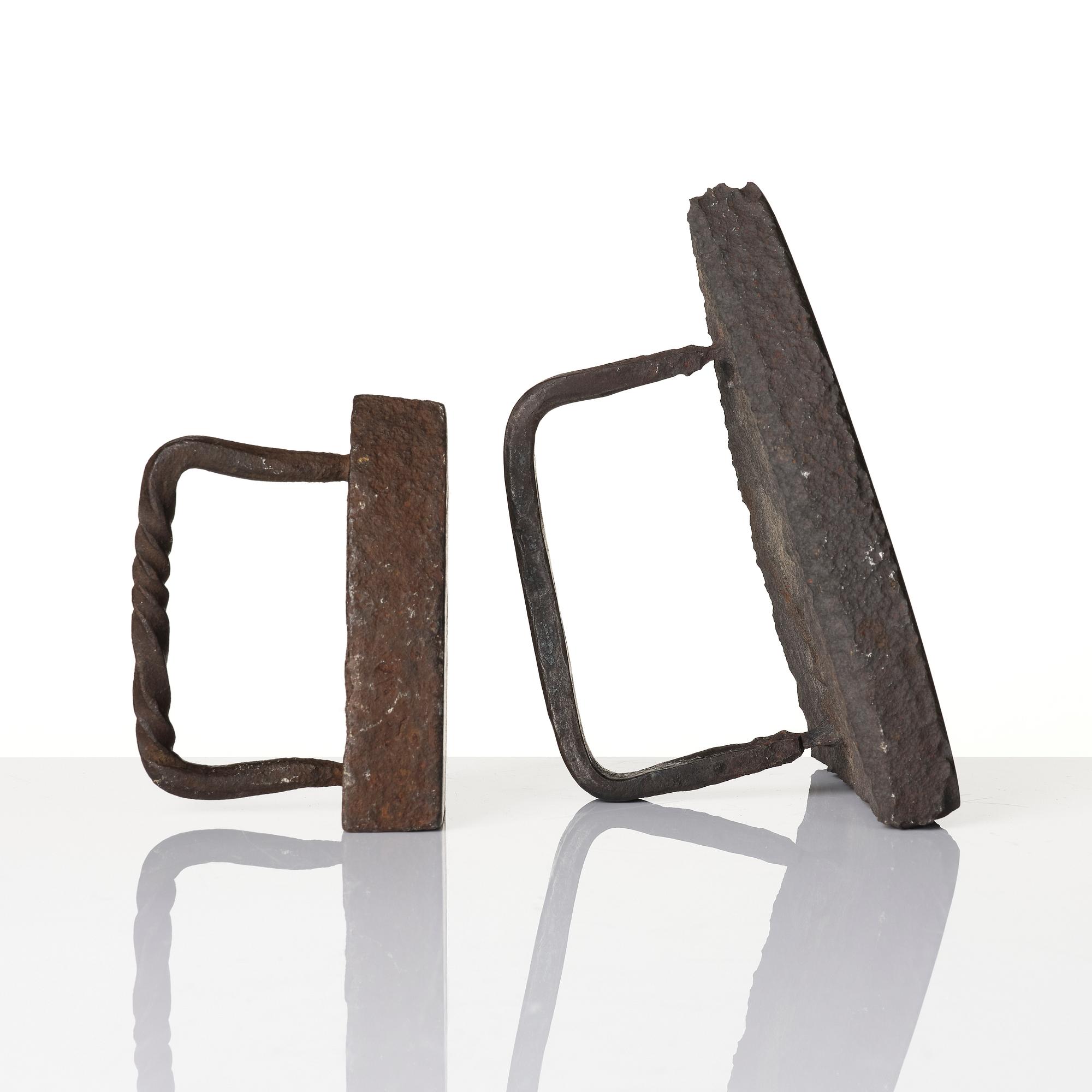 Two cast iron clothes irons, 18th / early 19th century.