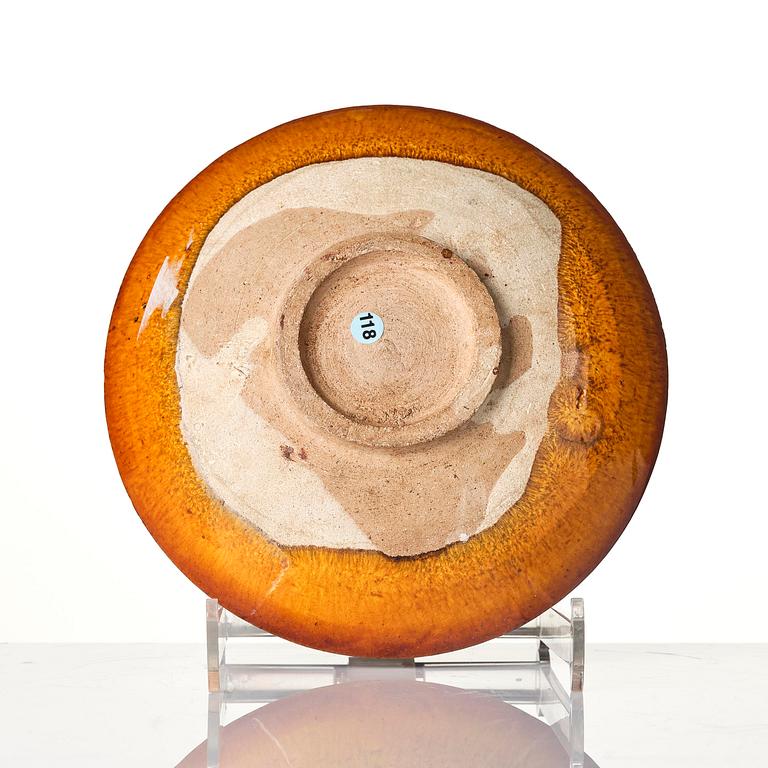 A yellow glazed dish, Liao dynasty (907–1125).