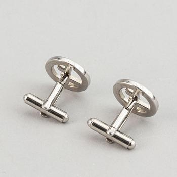Louis Vuitton and Giorgio Armani, two pairs of cufflinks.