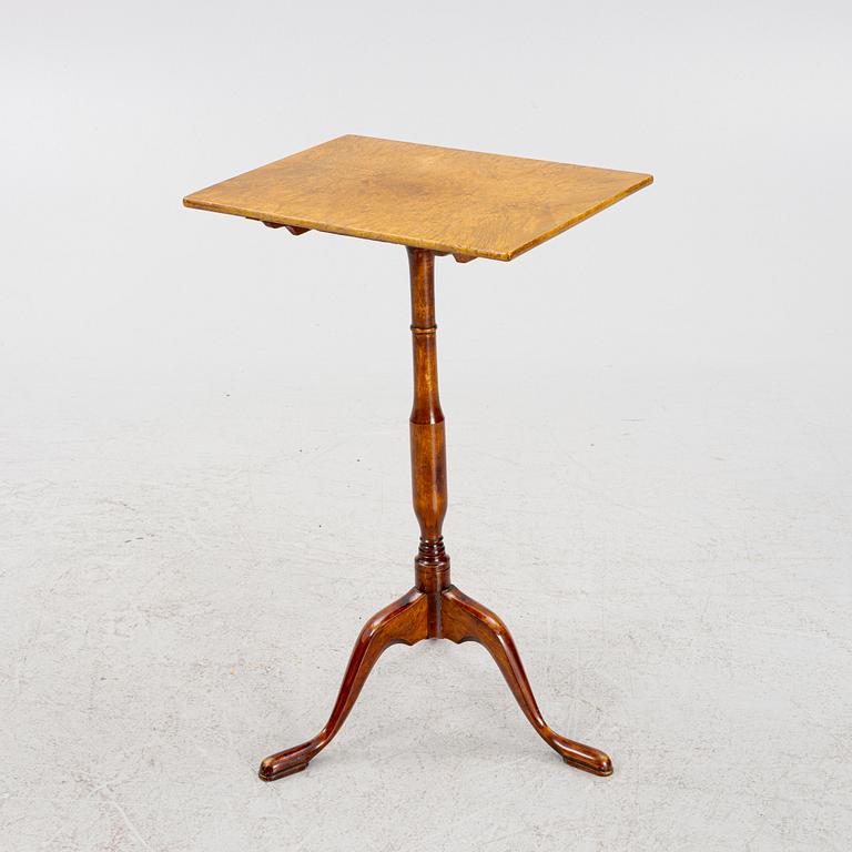 A drop-leaf table, 19th Century.