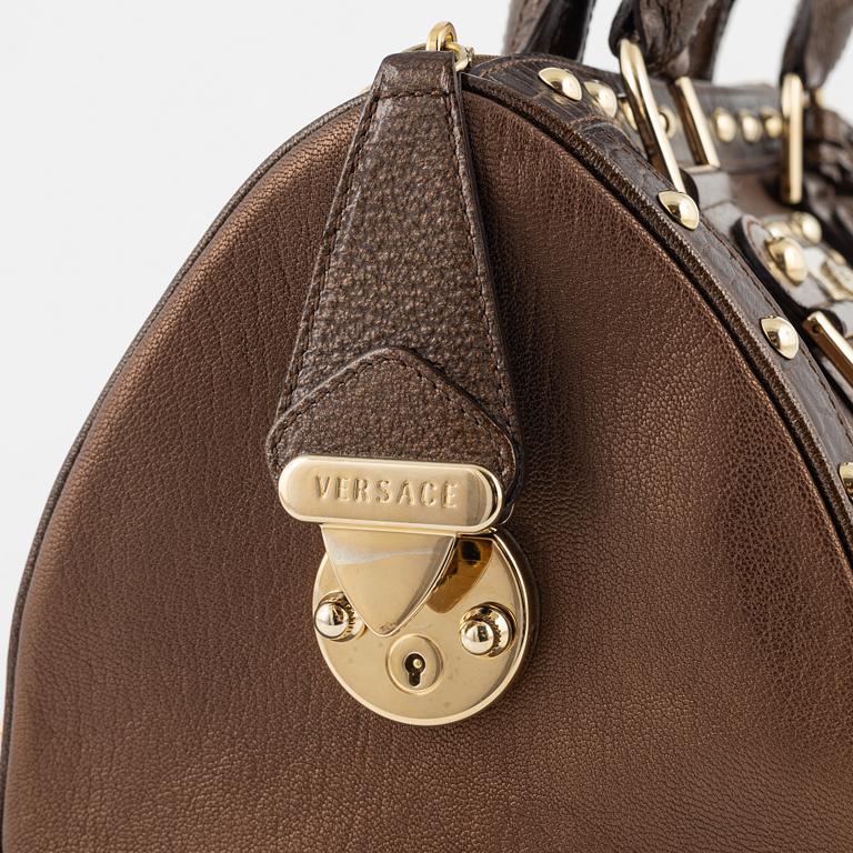 Versace, a bronze metallic leather handbag.