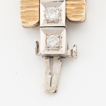 Bracelet in 14K gold and white gold with brilliant-cut diamonds.