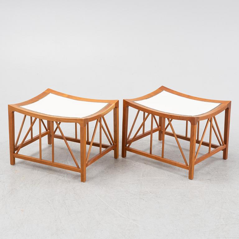Josef Frank, a pair of model 1063 cherry wood stools, Firma Svenskt Tenn, Sweden 21st century.