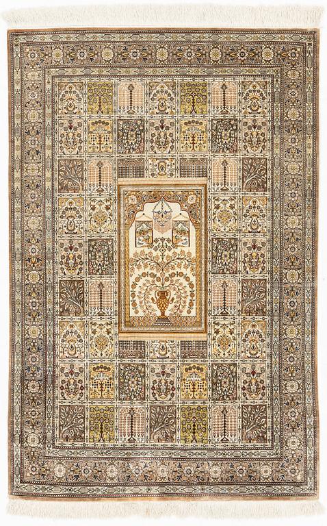 A carpet, oriental silk, circa 145 x 97 cm.