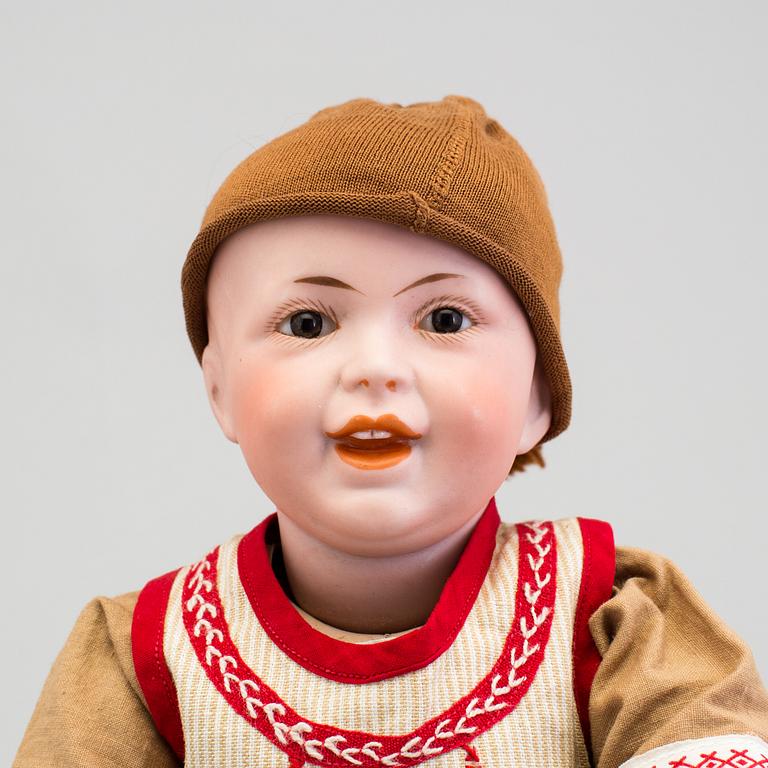 A bisque headed boy doll 235 by S.F.B.J, Paris, France, 1910s.