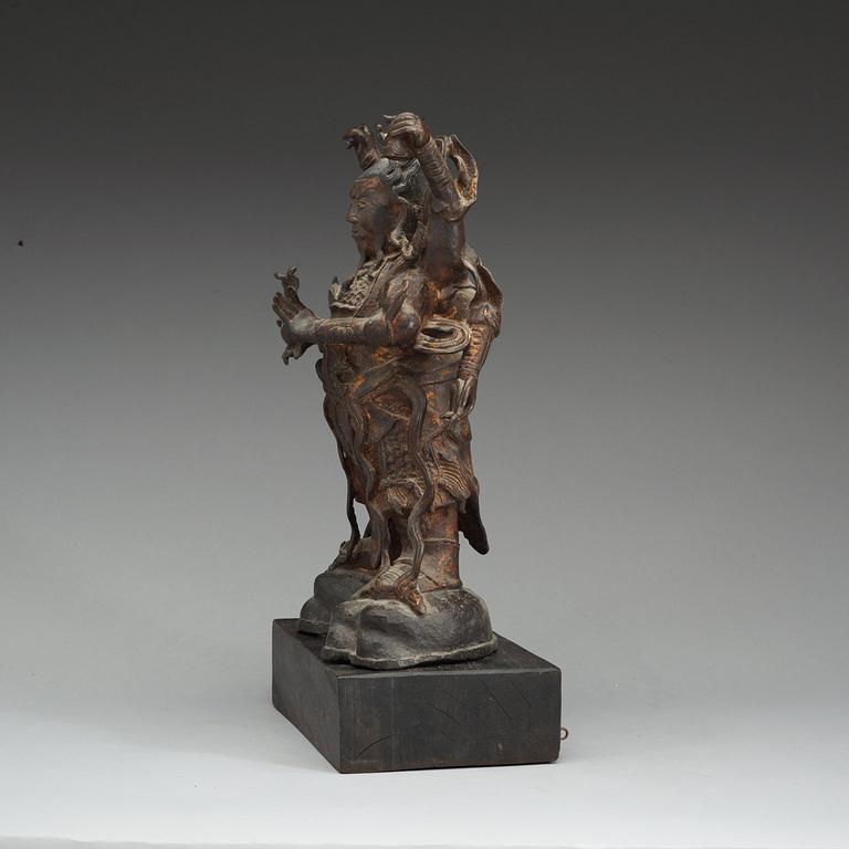 A bronze figure of a deity, late Ming dynasty (1368-1644).