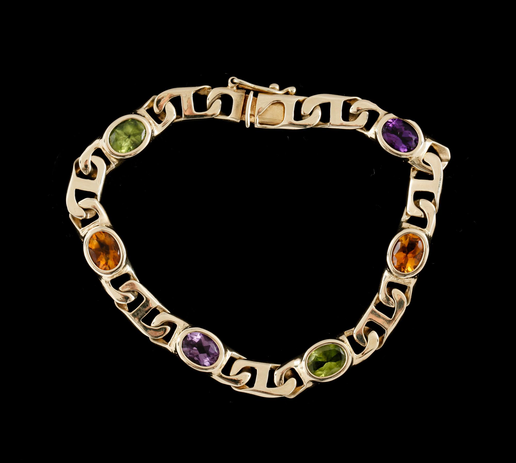 ARMBAND, 14k guld med peridoter, citriner och ametister. Ca 17 g.