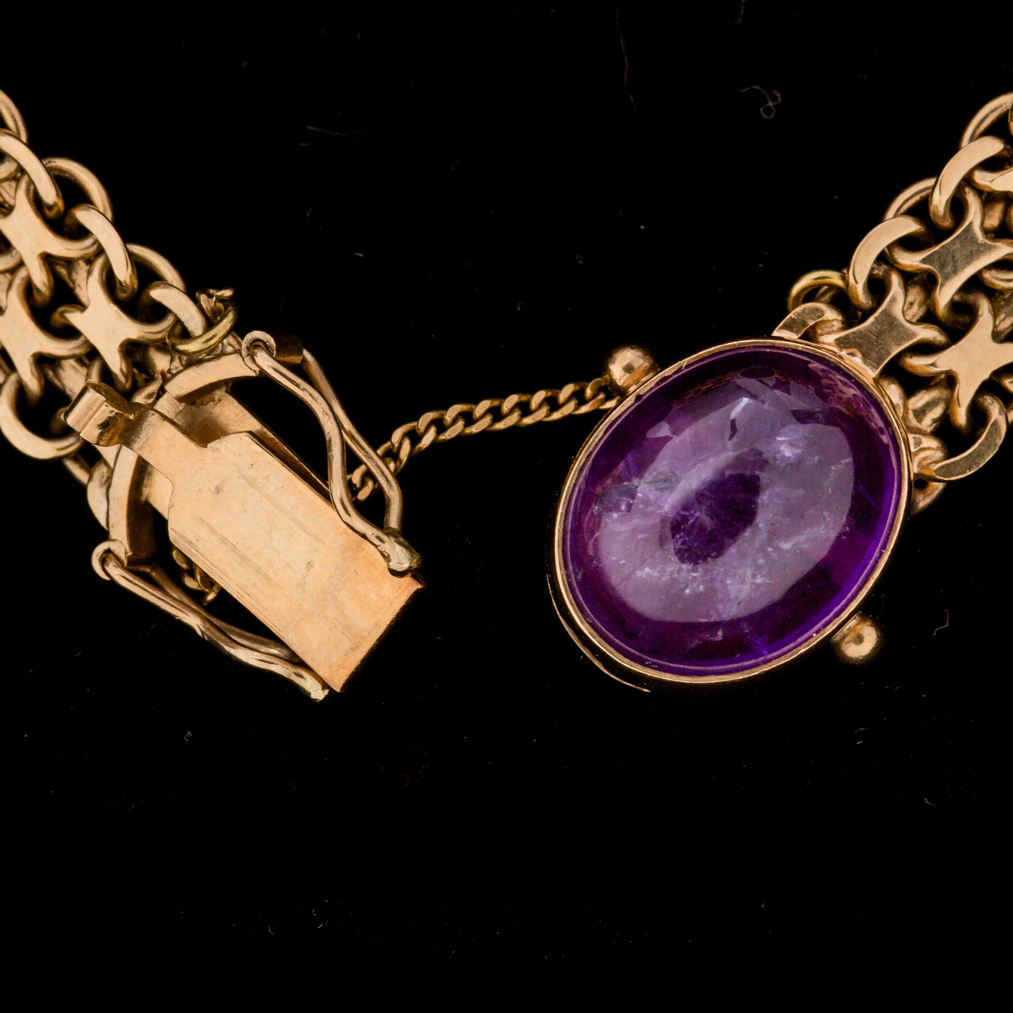 ÄRMLÄNK, 18 k guld med cabochonslipade ametister. Hugo Olsson, Helsingborg, 1971. Vikt ca 22 g.