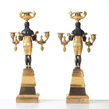 A pair of Empire three-light candelabra, circa 1810.