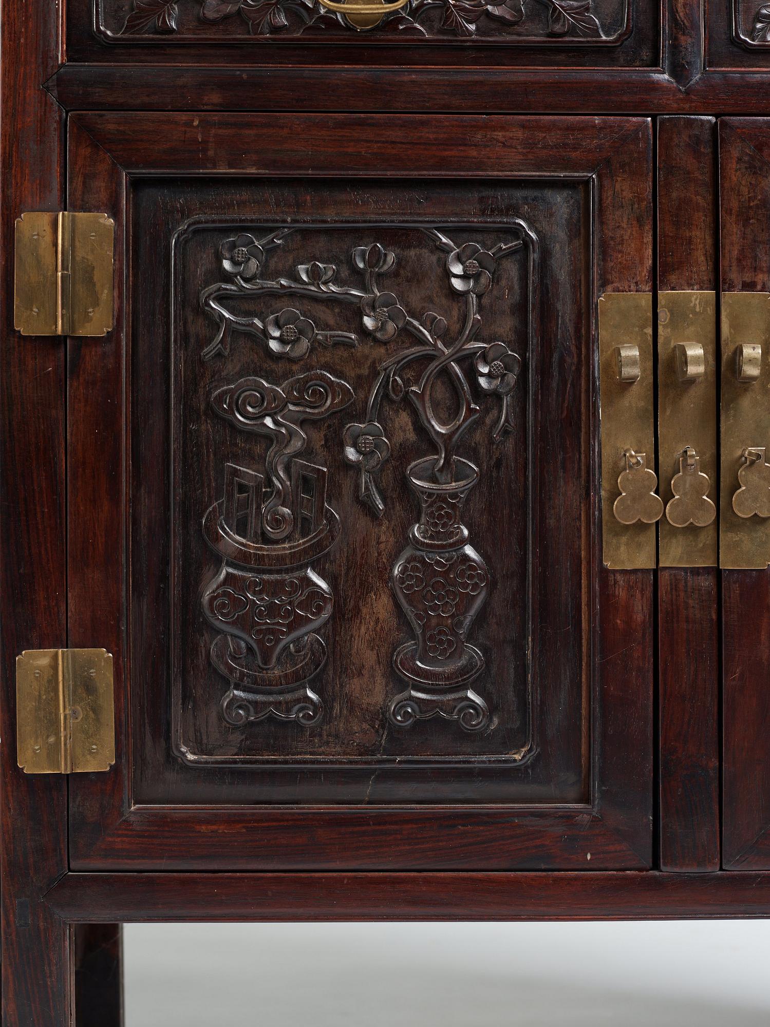 A pair of Chinese hardwood display cabinets, Qing dynasty, 19th Century.