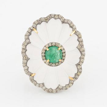 Ring with cut rock crystal, diamonds, and cabochon-cut emerald.