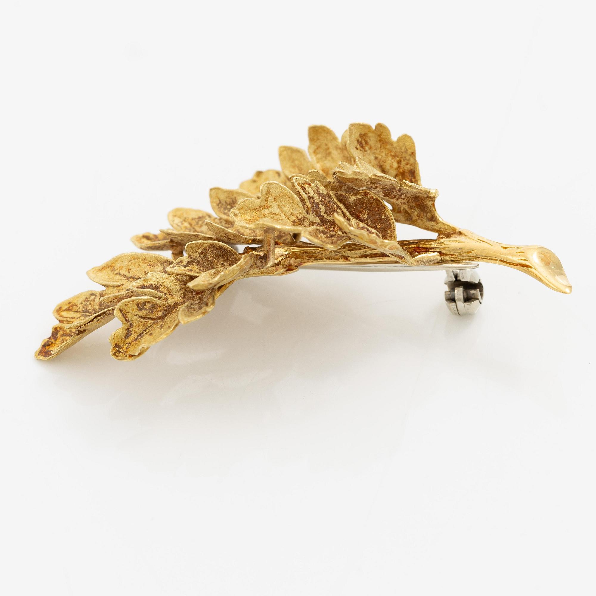 Brosch i form av ett löv 18K guld.