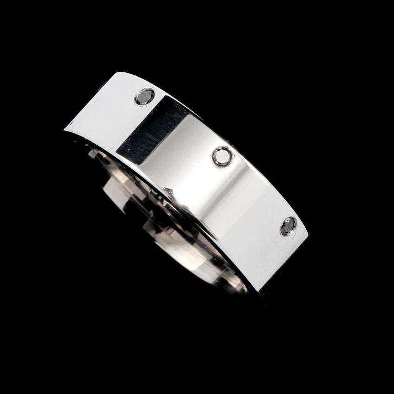 RING, 18k vitguld med 8 svarta briljantslipade diamanter, totalt 0.16 ct, Scahlins No1, Scahlins, Stockholm. Vikt 12 g.
